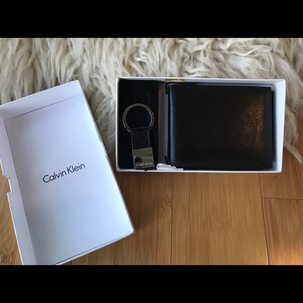 2 men’s black leather wallets. Calvin Klein/Fossil